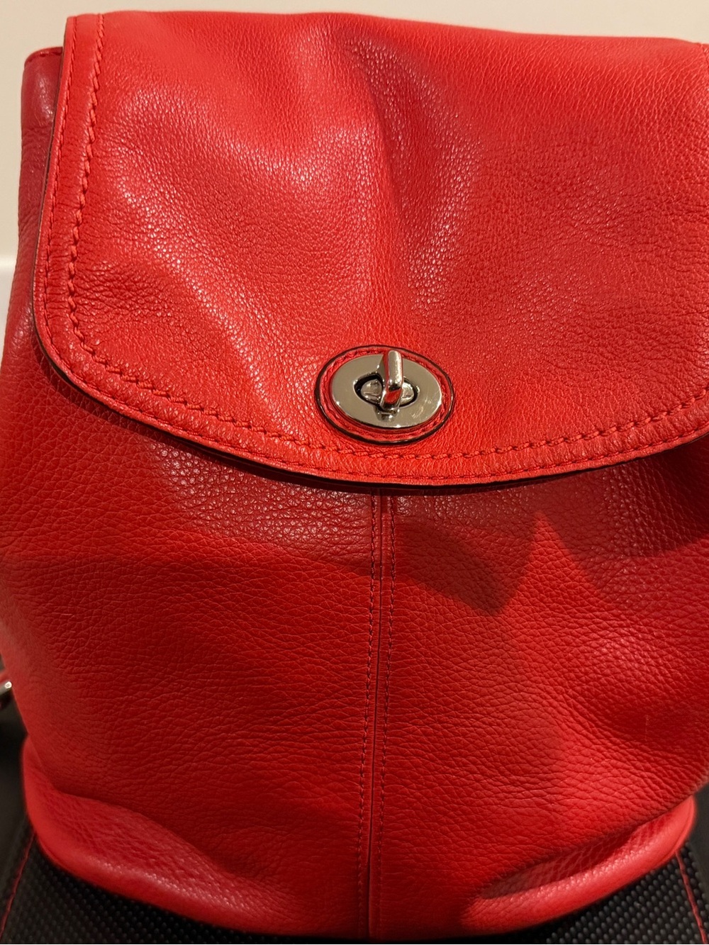 Coach Classic Orange Leather Women's Backpack with Turn-Lock Closure